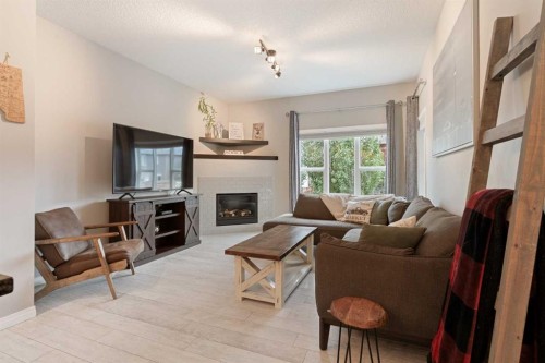95 Evansborough Common Nw, Calgary, AB - Indoor Photo Showing Living Room With Fireplace