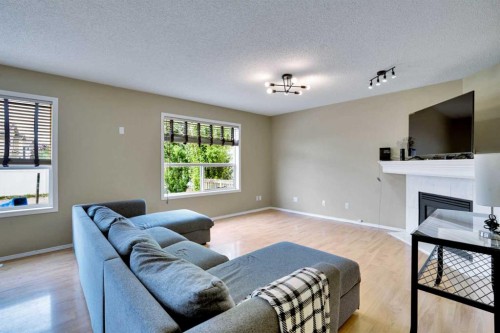 356 Chaparral Drive Se, Calgary, AB - Indoor Photo Showing Living Room With Fireplace