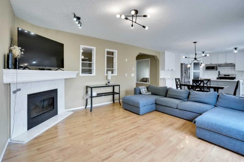 356 Chaparral Drive Se, Calgary, AB - Indoor Photo Showing Living Room With Fireplace