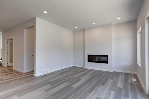 232 Creekstone Circle Sw, Calgary, AB - Indoor Photo Showing Other Room With Fireplace