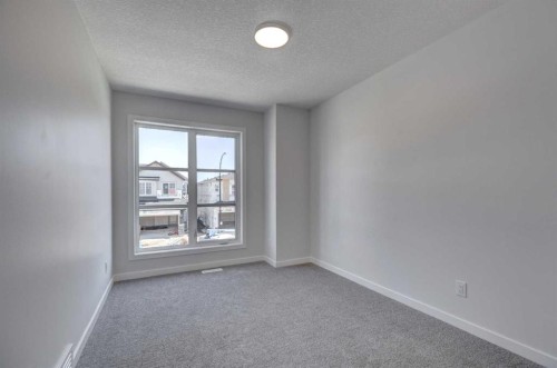 232 Creekstone Circle Sw, Calgary, AB - Indoor Photo Showing Other Room