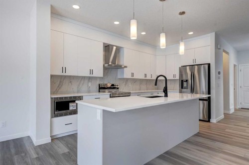 232 Creekstone Circle Sw, Calgary, AB - Indoor Photo Showing Kitchen With Upgraded Kitchen