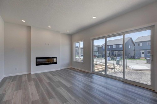232 Creekstone Circle Sw, Calgary, AB - Indoor Photo Showing Living Room With Fireplace