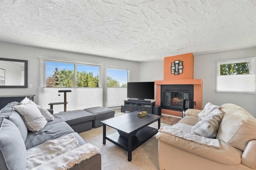 2326 19 Street Sw, Calgary, AB - Indoor Photo Showing Living Room With Fireplace