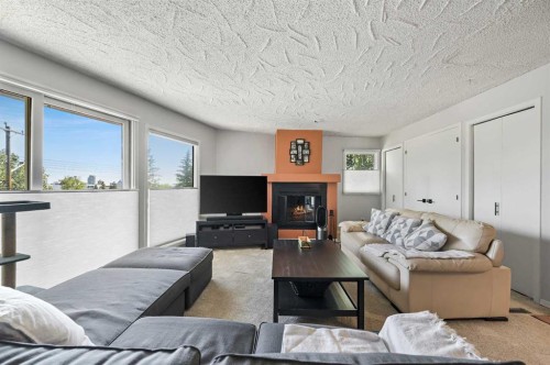 2326 19 Street Sw, Calgary, AB - Indoor Photo Showing Living Room With Fireplace