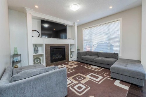 118 Saddlelake Way Ne, Calgary, AB - Indoor Photo Showing Living Room With Fireplace