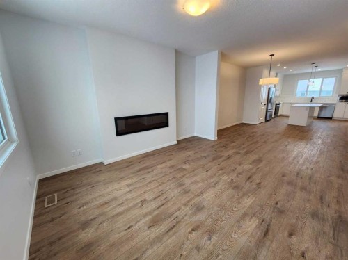 575 Lucas Boulevard Nw, Calgary, AB - Indoor Photo Showing Living Room With Fireplace
