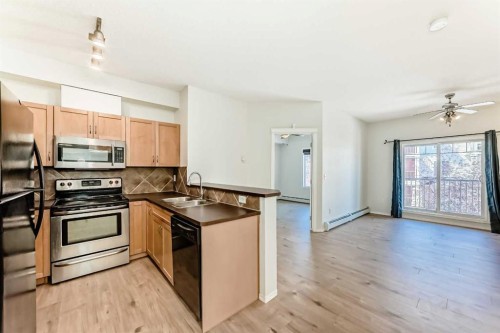 5311-70 Panamount Drive Nw, Calgary, AB - Indoor Photo Showing Kitchen With Double Sink