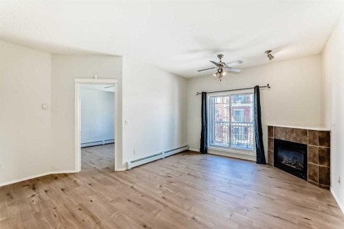 5311-70 Panamount Drive Nw, Calgary, AB - Indoor Photo Showing Other Room With Fireplace