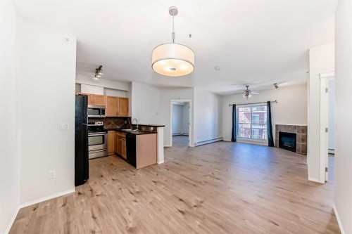 5311-70 Panamount Drive Nw, Calgary, AB - Indoor Photo Showing Other Room With Fireplace