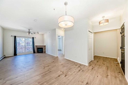 5311-70 Panamount Drive Nw, Calgary, AB - Indoor Photo Showing Living Room With Fireplace