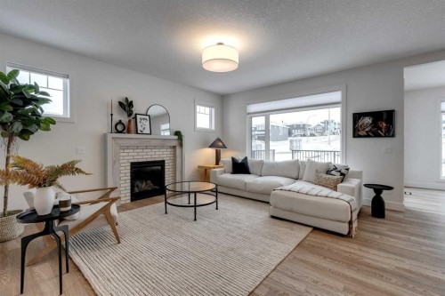 483 Rivercrest View, Cochrane, AB - Indoor Photo Showing Living Room With Fireplace