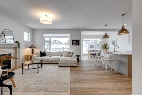 483 Rivercrest View, Cochrane, AB - Indoor Photo Showing Living Room With Fireplace