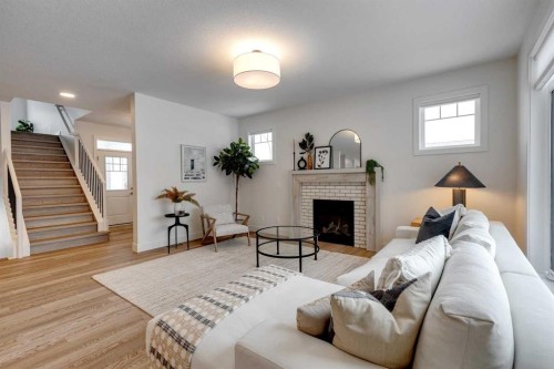483 Rivercrest View, Cochrane, AB - Indoor Photo Showing Living Room With Fireplace
