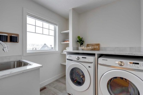 483 Rivercrest View, Cochrane, AB - Indoor Photo Showing Laundry Room