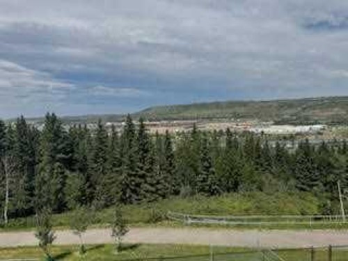 483 Rivercrest View, Cochrane, AB - Outdoor With Body Of Water With View