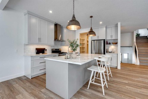 483 Rivercrest View, Cochrane, AB - Indoor Photo Showing Kitchen With Upgraded Kitchen