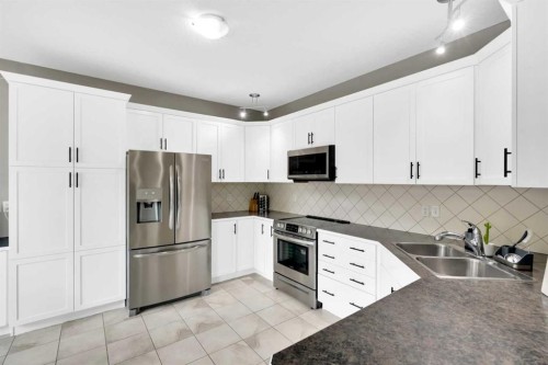 2020 Windsong Drive Sw, Airdrie, AB - Indoor Photo Showing Kitchen With Double Sink With Upgraded Kitchen