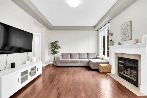 2020 Windsong Drive Sw, Airdrie, AB - Indoor Photo Showing Living Room With Fireplace