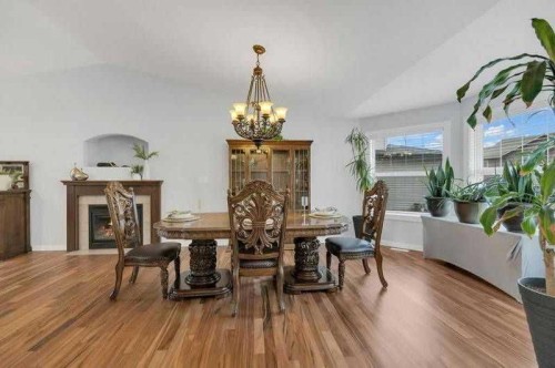 3 Liberty Place, Sylvan Lake, AB - Indoor Photo Showing Dining Room With Fireplace