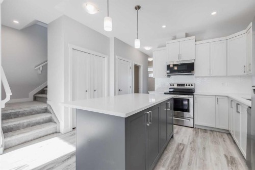 461 South Point Glen Sw, Airdrie, AB - Indoor Photo Showing Kitchen With Upgraded Kitchen