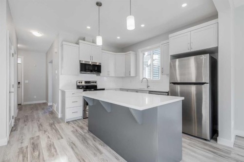 461 South Point Glen Sw, Airdrie, AB - Indoor Photo Showing Kitchen With Upgraded Kitchen