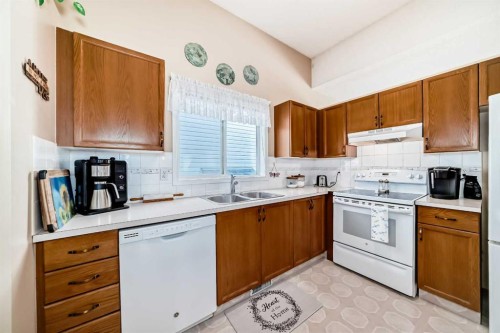 76 Hidden Way Nw, Calgary, AB - Indoor Photo Showing Kitchen With Double Sink