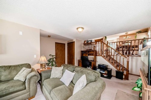 76 Hidden Way Nw, Calgary, AB - Indoor Photo Showing Living Room