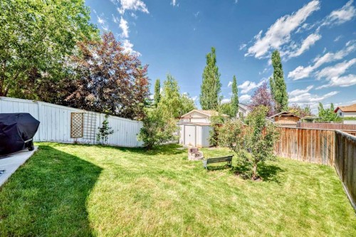76 Hidden Way Nw, Calgary, AB - Outdoor With Backyard