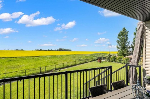 653 West Highland Crescent, Carstairs, AB - Outdoor With Deck Patio Veranda With View