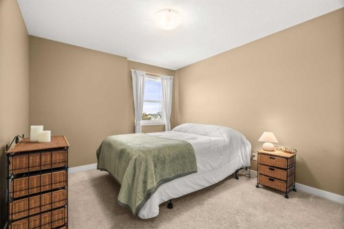 653 West Highland Crescent, Carstairs, AB - Indoor Photo Showing Bedroom