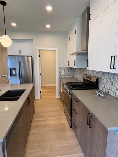 111 Chinook Winds Manor Sw, Airdrie, AB - Indoor Photo Showing Kitchen With Stainless Steel Kitchen With Double Sink