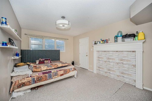 1306 1 Avenue, Canmore, AB - Indoor Photo Showing Bedroom