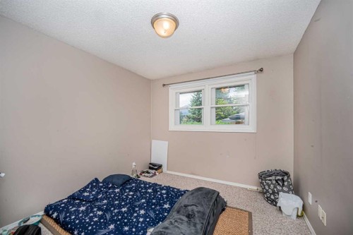 1306 1 Avenue, Canmore, AB - Indoor Photo Showing Bedroom