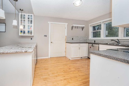 1306 1 Avenue, Canmore, AB - Indoor Photo Showing Kitchen With Double Sink