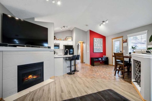 128 Cramond Crescent Se, Calgary, AB - Indoor With Fireplace