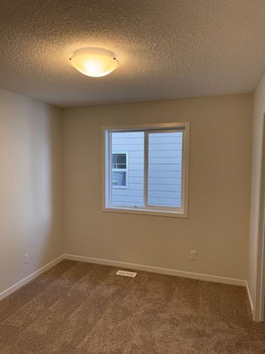 17 Setonvista Gate Se, Calgary, AB - Indoor Photo Showing Other Room