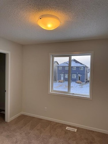 17 Setonvista Gate Se, Calgary, AB - Indoor Photo Showing Other Room