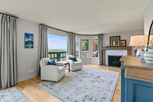 188 Artists View Way, Rural Rocky View County, AB - Indoor Photo Showing Living Room With Fireplace