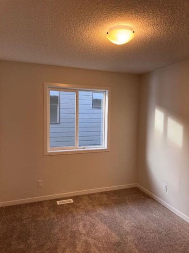 21 Setonvista Gate Se, Calgary, AB - Indoor Photo Showing Other Room