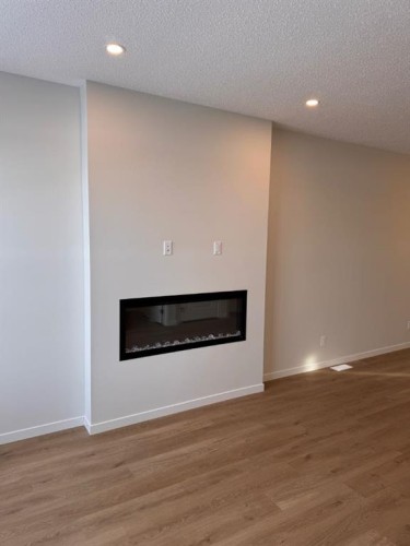 21 Setonvista Gate Se, Calgary, AB - Indoor With Fireplace