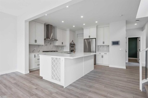 33 Magnolia Path Se, Calgary, AB - Indoor Photo Showing Kitchen With Upgraded Kitchen