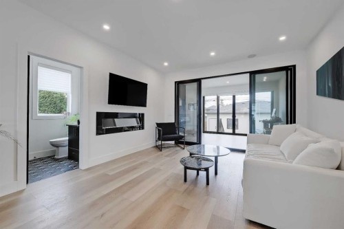1440 26A Street Sw, Calgary, AB - Indoor Photo Showing Living Room With Fireplace