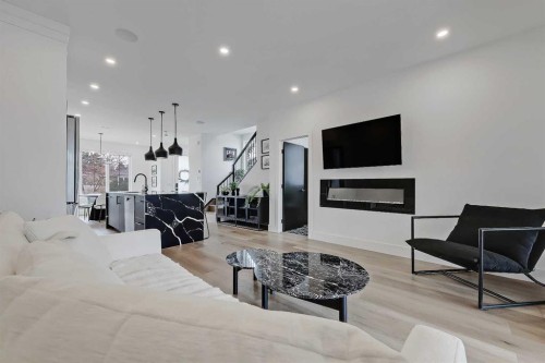 1440 26A Street Sw, Calgary, AB - Indoor Photo Showing Living Room With Fireplace