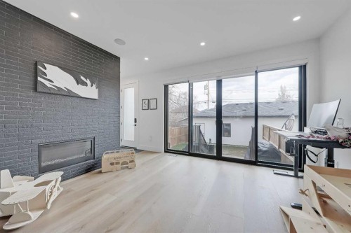 1440 26A Street Sw, Calgary, AB - Indoor With Fireplace