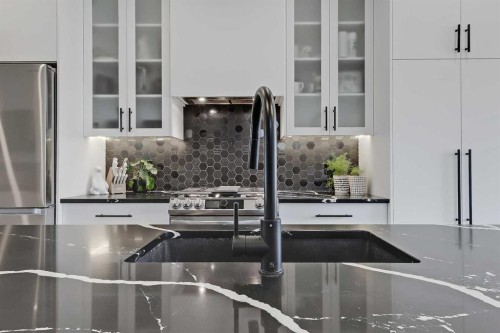 1440 26A Street Sw, Calgary, AB - Indoor Photo Showing Kitchen With Stainless Steel Kitchen With Double Sink With Upgraded Kitchen