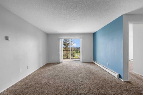 6307-304 Mackenzie Way Sw, Airdrie, AB - Indoor Photo Showing Other Room