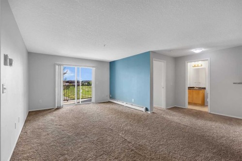 6307-304 Mackenzie Way Sw, Airdrie, AB - Indoor Photo Showing Other Room