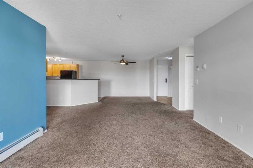 6307-304 Mackenzie Way Sw, Airdrie, AB - Indoor Photo Showing Other Room