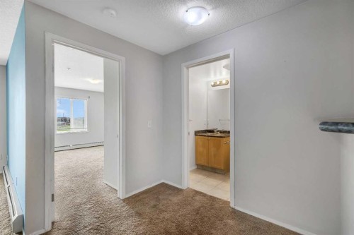 6307-304 Mackenzie Way Sw, Airdrie, AB - Indoor Photo Showing Other Room